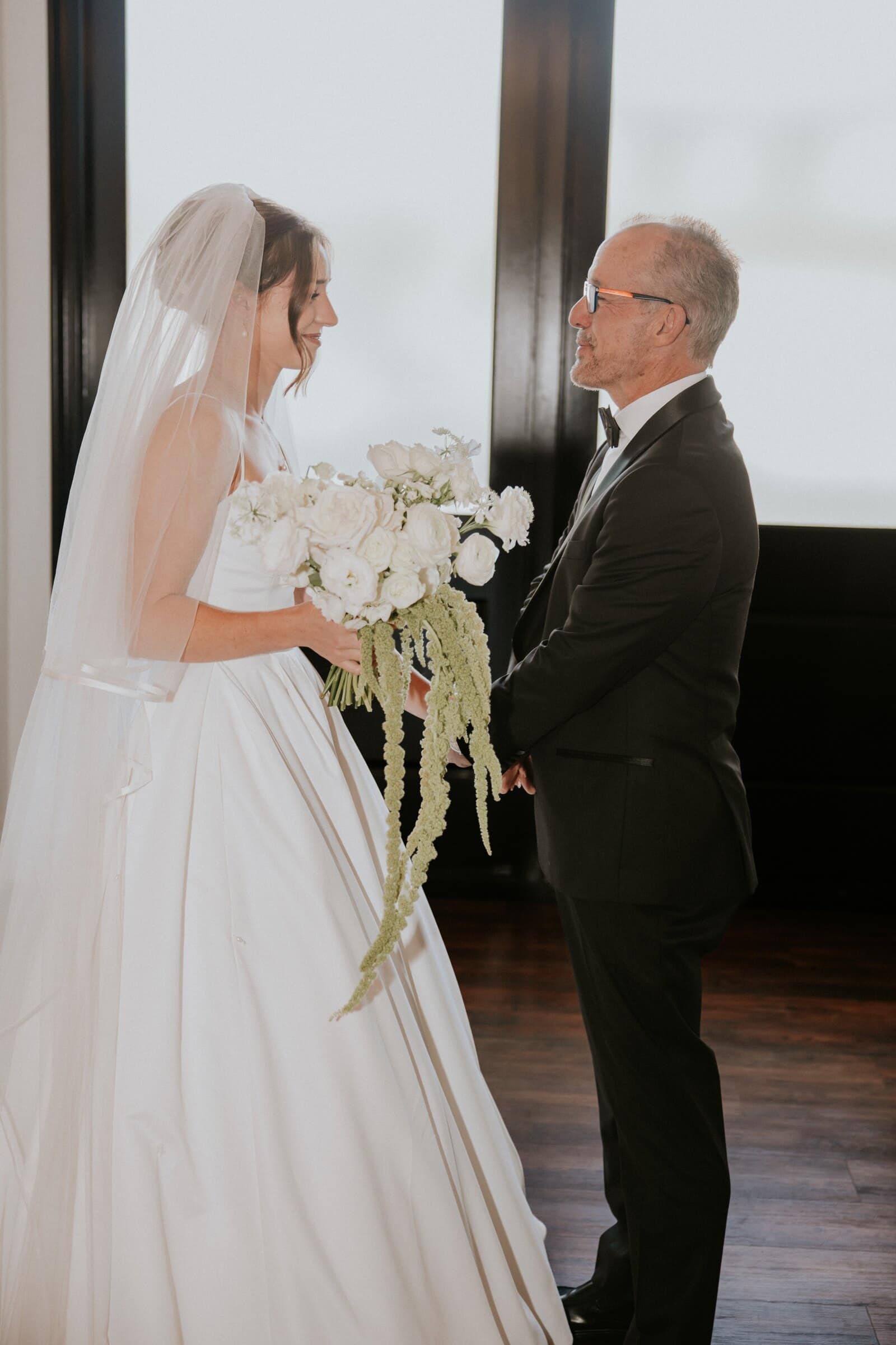 A quiet moment by the window before the ceremony